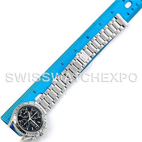 The image shows an Omega Speedmaster 3513.50.00 Men's Stainless Steel Black Dial 3513.50.00 Men's Stainless Steel Black Dial watch laid flat next to a ruler, showcasing the entire band and face from a top-down angle.