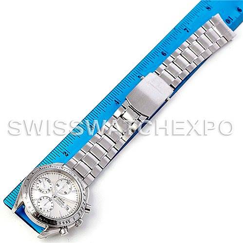 The image shows an overhead view of an Omega Speedmaster 3211.30.00 Men
s Stainless Steel Silver Dial 3211.30.00 Men
s Stainless Steel Silver Dial watch, including its face and full metal bracelet, measured against a ruler.