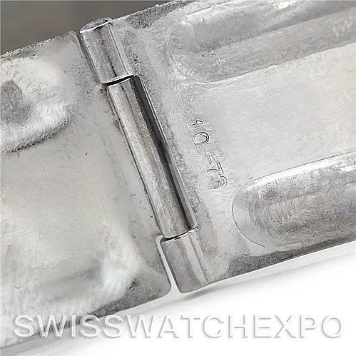 This image shows a close-up of the clasp and hinge mechanism of an Omega Speedmaster 105.003-65 Men's Stainless Steel Black Dial 105.003-65 Men's Stainless Steel Black Dial watch bracelet.