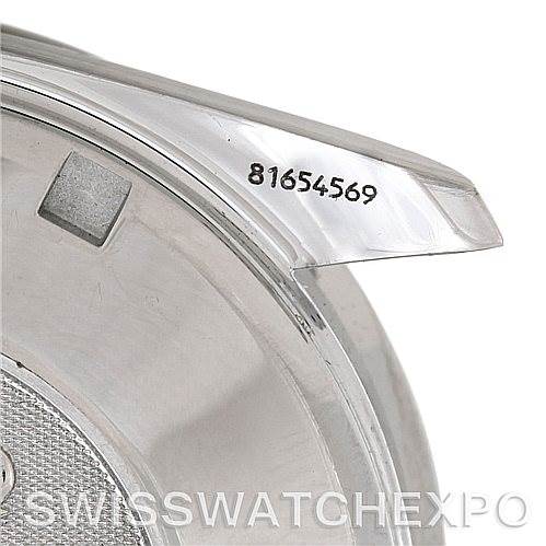 This image shows a close-up of the Omega Speedmaster 3210.50.00 Men
s Stainless Steel Black Dial 3210.50.00 Men
s Stainless Steel Black Dial
s case, highlighting the serial number engraved on the lug.