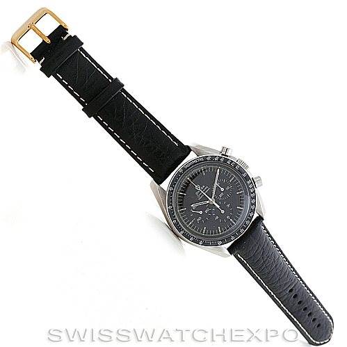 The image shows an Omega Speedmaster Men
s Stainless Steel Black Dial Men
s Stainless Steel Black Dial watch at an oblique angle, capturing the strap and face prominently.