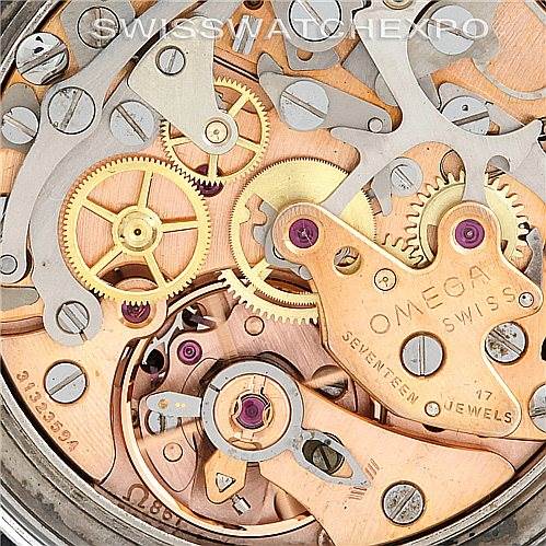 This image shows a close-up view of the movement and internal mechanics of an Omega Speedmaster Men
s Stainless Steel Black Dial Men
s Stainless Steel Black Dial watch.