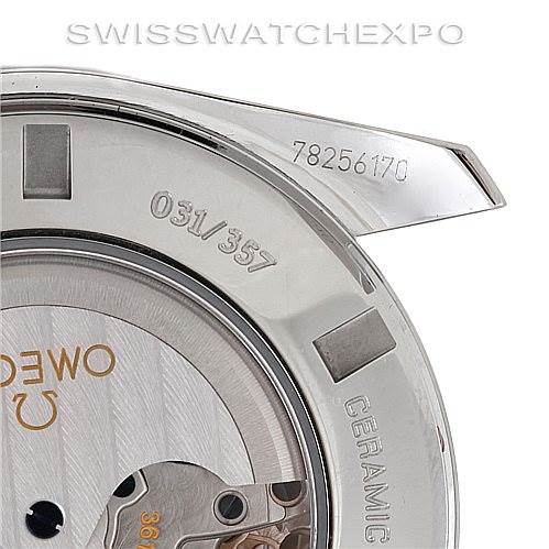 The image shows a close-up of the back of an Omega Speedmaster 311.30.44.51.01.001 Men
s Stainless Steel Black Dial 311.30.44.51.01.001 Men
s Stainless Steel Black Dial watch, highlighting the serial numbers and part of the movement.