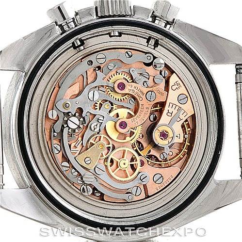 The image shows the inner mechanical movement of an Omega Speedmaster Men
s Stainless Steel Black Dial Men
s Stainless Steel Black Dial watch viewed from the back with the case opened.