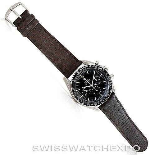 The image shows an Omega Speedmaster Men
s Stainless Steel Black Dial Men
s Stainless Steel Black Dial watch with a full view of its dial and brown leather strap, angled slightly to the right.