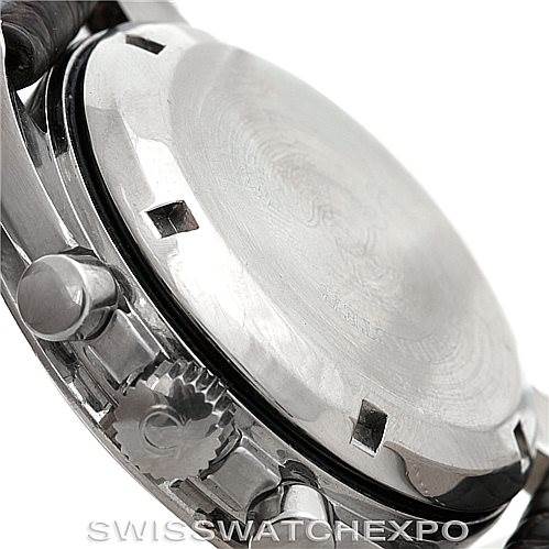 The image shows the case back, crown, and pushers of an Omega Speedmaster Men
s Stainless Steel Black Dial Men
s Stainless Steel Black Dial watch from a side angle.