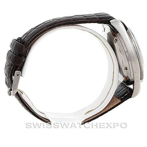 The image shows a side view of an Omega Speedmaster Men
s Stainless Steel Black Dial Men
s Stainless Steel Black Dial watch, highlighting its case, crown, and brown leather strap.