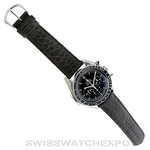 The image shows an Omega Speedmaster 145.022-69 Men
s Stainless Steel Black Dial 145.022-69 Men
s Stainless Steel Black Dial watch from a top-down angle, displaying the watch face and leather strap.
