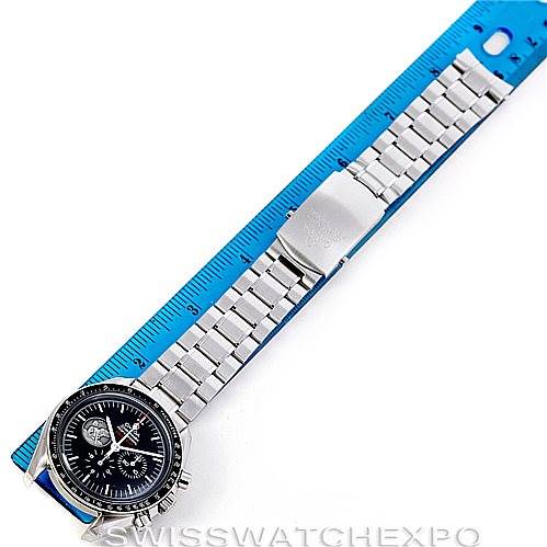 The image shows an Omega Speedmaster 311.30.42.30.01.002 Men's Stainless Steel Black Dial 311.30.42.30.01.002 Men's Stainless Steel Black Dial watch laid flat with a full view of the dial and bracelet next to a blue ruler for measurement.