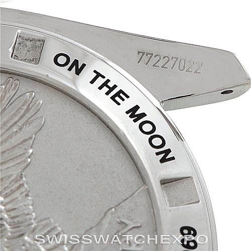 The image shows a close-up view of the back of an Omega Speedmaster 311.30.42.30.01.002 Men's Stainless Steel Black Dial 311.30.42.30.01.002 Men's Stainless Steel Black Dial watch, featuring text "ON THE MOON" and the serial number.