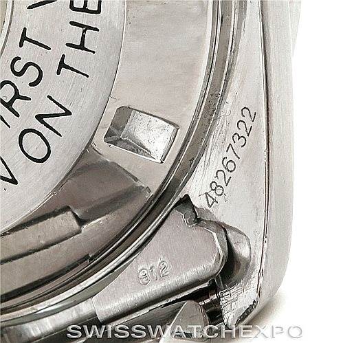 This image shows a close-up of the Omega Speedmaster Men
s Stainless Steel Black Dial Men
s Stainless Steel Black Dial
s case back and serial number, including part of the bracelet and lugs.