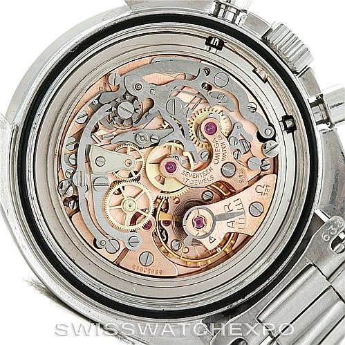 This image shows the intricate inner workings of an Omega Speedmaster Men
s Stainless Steel Black Dial Men
s Stainless Steel Black Dial watch from the back, displaying its movement and gears.