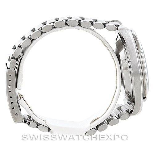 This side view of the Omega Speedmaster Men
s Stainless Steel Black Dial Men
s Stainless Steel Black Dial watch shows the bracelet, case, and partially the bezel.