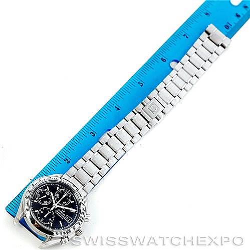 The image shows the Omega Speedmaster 3513.50.00 Men
s Stainless Steel Black Dial 3513.50.00 Men
s Stainless Steel Black Dial watch laid flat on a ruler, displaying its face and full stainless steel bracelet.