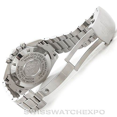 The image shows the back and open clasp of the Omega Speedmaster 3570.50.00 Men's Stainless Steel Black Dial 3570.50.00 Men's Stainless Steel Black Dial watch, highlighting the engraved case back.