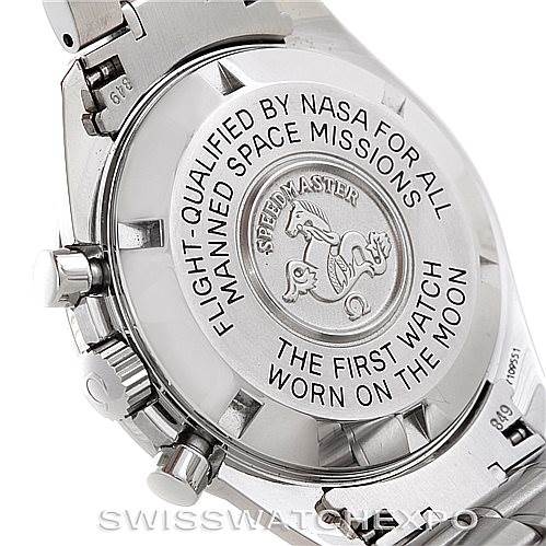 The image shows the case back of an Omega Speedmaster 3570.50.00 Men's Stainless Steel Black Dial 3570.50.00 Men's Stainless Steel Black Dial watch, with its engraved text and emblem.