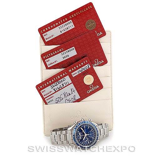 The image displays a front view of the Omega Speedmaster 3222.80.00 Men
s Stainless Steel Blue Dial 3222.80.00 Men
s Stainless Steel Blue Dial watch along with its warranty and certification cards.