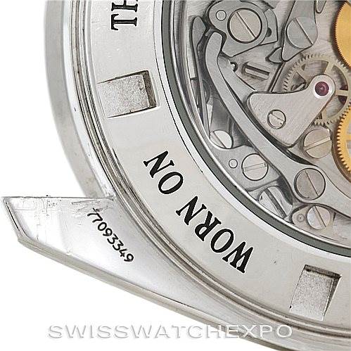 The image shows a close-up of the case back and movement of an Omega Speedmaster 3573.50.00 Men
s Stainless Steel Black Dial 3573.50.00 Men
s Stainless Steel Black Dial watch.