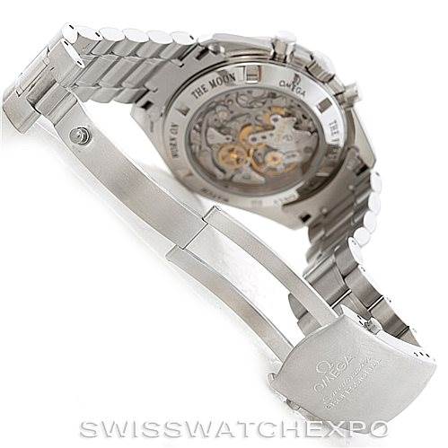 The image shows the back and clasp of the Omega Speedmaster 3573.50.00 Men
s Stainless Steel Black Dial 3573.50.00 Men
s Stainless Steel Black Dial watch, highlighting its intricate mechanism and stainless steel bracelet.