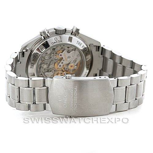 The image shows the back view of an Omega Speedmaster 3573.50.00 Men
s Stainless Steel Black Dial 3573.50.00 Men
s Stainless Steel Black Dial watch, highlighting its movement and metal bracelet with the clasp visible.