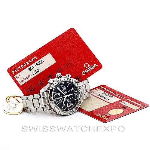 The image shows an Omega Speedmaster 3513.50.00 Men
s Stainless Steel Black Dial 3513.50.00 Men
s Stainless Steel Black Dial watch placed on its side, accompanied by two red Omega certification cards and a tag.
