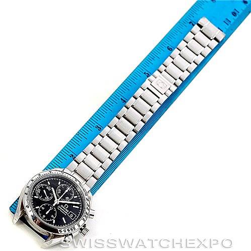 This image shows an Omega Speedmaster 3513.50.00 Men
s Stainless Steel Black Dial 3513.50.00 Men
s Stainless Steel Black Dial watch laid flat, measured against a blue ruler, highlighting the face and metal band.