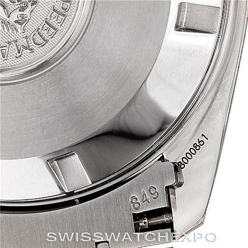 The image shows the case back and partial bracelet of an Omega Speedmaster 3552.59.00 Men
s Stainless Steel Black Dial 3552.59.00 Men
s Stainless Steel Black Dial watch, featuring engraving details and serial numbers.