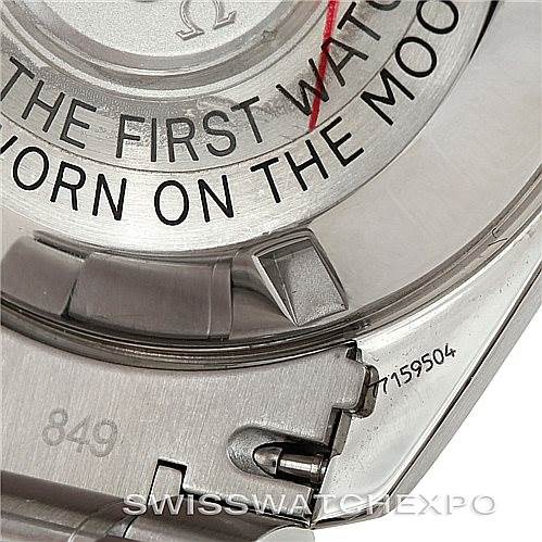 The image shows a close-up of the case back and part of the bracelet of an Omega Speedmaster Men
s Stainless Steel Black Dial Men
s Stainless Steel Black Dial watch.