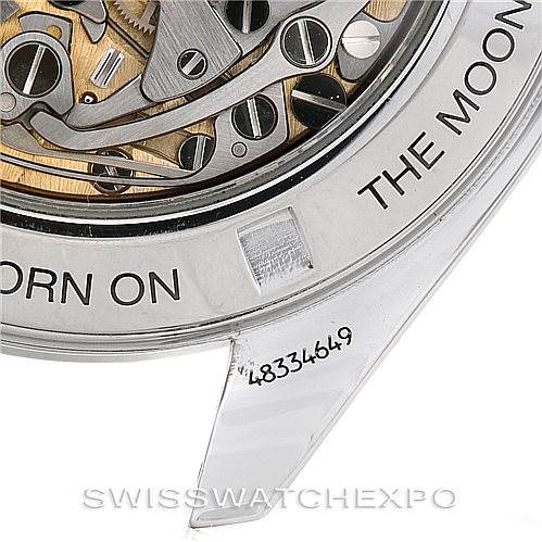 This is a close-up of an Omega Speedmaster 3572.50.00 Men
s Stainless Steel Black Dial 3572.50.00 Men
s Stainless Steel Black Dial watch, showing part of the movement and the "THE MOON" text on the caseback.
