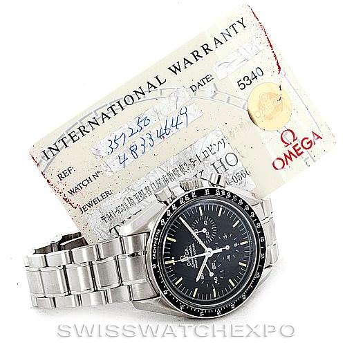 The image shows an Omega Speedmaster 3572.50.00 Men
s Stainless Steel Black Dial 3572.50.00 Men
s Stainless Steel Black Dial watch at a slight angle, with the warranty card displayed behind it.