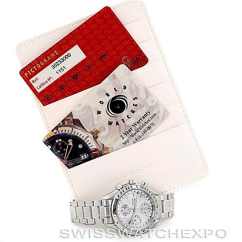 The image shows an Omega Speedmaster 3523.30.00 Men
s Stainless Steel Silver Dial 3523.30.00 Men
s Stainless Steel Silver Dial watch along with warranty cards from a top-down angle.