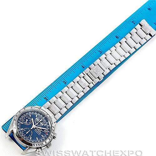 The image shows an Omega Speedmaster 3523.80.00 Men
s Stainless Steel Blue Dial 3523.80.00 Men
s Stainless Steel Blue Dial watch laid flat, with a blue ruler for scale, displaying the face and stainless steel bracelet.
