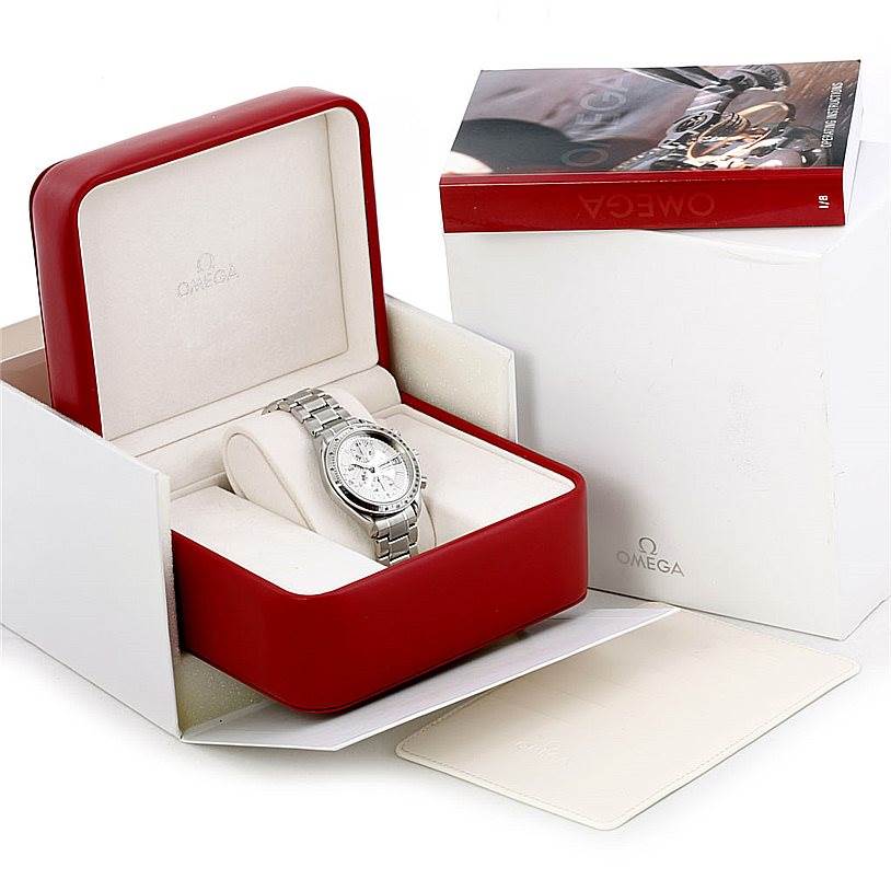 The Omega Speedmaster 3513.30.00 Men
s Stainless Steel Silver Dial 3513.30.00 Men
s Stainless Steel Silver Dial watch is shown in a red display box, accompanied by manuals and outer packaging.