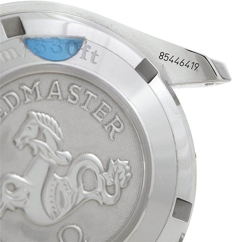 Close-up of the case back of the Omega Speedmaster 3210.51.00 Men's Stainless Steel Black Dial 3210.51.00 Men's Stainless Steel Black Dial watch, showing its engravings and part of the case.