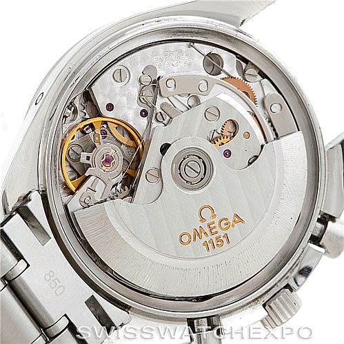 The image shows the inner mechanical movement of an Omega Speedmaster 3523.80.00 Men
s Stainless Steel Blue Dial 3523.80.00 Men
s Stainless Steel Blue Dial, highlighting its intricate gears and the rotor labeled "OMEGA 1151".