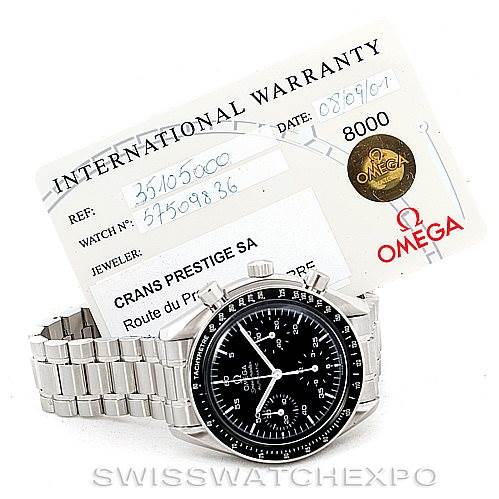 The image shows an Omega Speedmaster 3510.50.00 Men
s Stainless Steel Black Dial 3510.50.00 Men
s Stainless Steel Black Dial watch at an angle with its face and bracelet visible, along with its international warranty card.