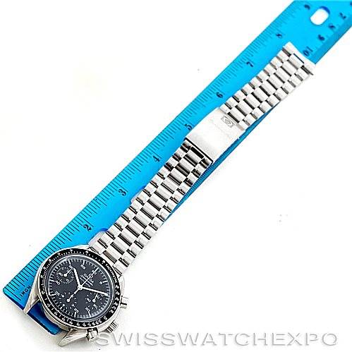 The Omega Speedmaster 3510.50.00 Men
s Stainless Steel Black Dial 3510.50.00 Men
s Stainless Steel Black Dial watch is shown from an overhead angle, featuring its face, bezel, and metal bracelet fully extended beside a ruler.