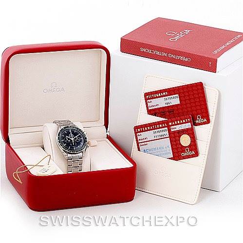 The image shows an Omega Speedmaster 3570.50.00 Men
s Stainless Steel Black Dial 3570.50.00 Men
s Stainless Steel Black Dial watch in a red Omega box with operating instructions and warranty cards displayed beside it.