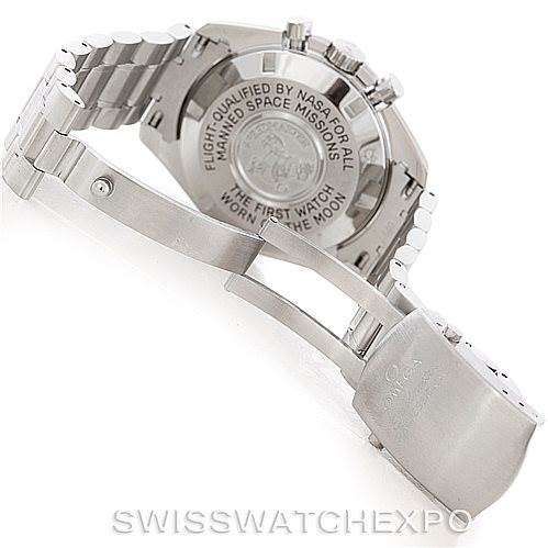 The image shows the back of an Omega Speedmaster 3570.50.00 Men
s Stainless Steel Black Dial 3570.50.00 Men
s Stainless Steel Black Dial watch, highlighting the engraved case back and partially open metal bracelet.