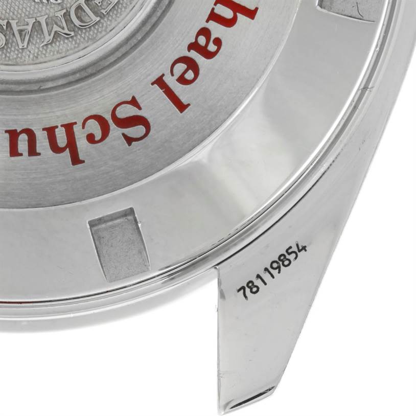 The image shows the back case and serial number of an Omega Speedmaster 3507.51.00 Men
s Stainless Steel Black Dial 3507.51.00 Men
s Stainless Steel Black Dial watch, viewed from a close-up angle.