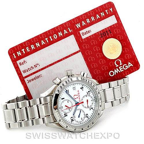 The image shows an Omega Speedmaster 3515.20.00 Men
s Stainless Steel White Dial 3515.20.00 Men
s Stainless Steel White Dial watch positioned at an angle, resting against an International Warranty card.