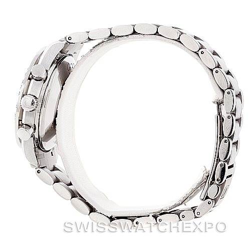 The image shows a side view of the Omega Speedmaster 3515.20.00 Men
s Stainless Steel White Dial 3515.20.00 Men
s Stainless Steel White Dial, focusing on the watch
s case, crown, and metal bracelet.