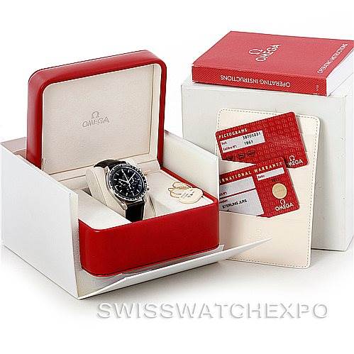 The image shows an Omega Speedmaster 3870.50.31 Men
s Stainless Steel Black Dial 3870.50.31 Men
s Stainless Steel Black Dial watch with its accessories, including the watch box, operating instructions, and warranty cards.