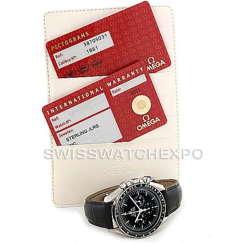 The image shows an Omega Speedmaster 3870.50.31 Men
s Stainless Steel Black Dial 3870.50.31 Men
s Stainless Steel Black Dial watch from a frontal angle, along with its certification and international warranty cards.