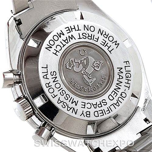 The image shows the back case of an Omega Speedmaster 3570.50.00 Men's Stainless Steel Black Dial 3570.50.00 Men's Stainless Steel Black Dial watch, highlighting the engraved text and emblem.