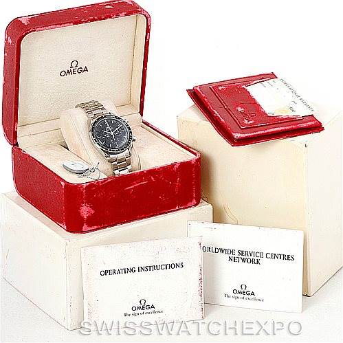 The image shows an Omega Speedmaster 3570.50.00 Men's Stainless Steel Black Dial 3570.50.00 Men's Stainless Steel Black Dial watch in its box, along with its operating instructions and service center booklet.