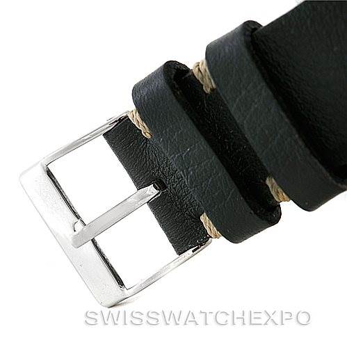 The image shows a close-up angle of the black leather strap and silver buckle of an Omega Speedmaster Men
s Stainless Steel Black Dial Men
s Stainless Steel Black Dial watch.