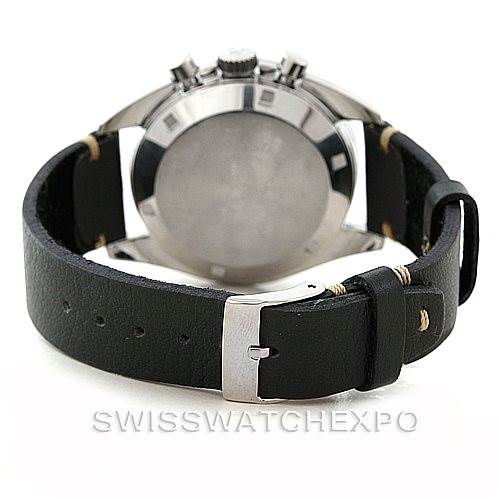 The image shows the back view of an Omega Speedmaster Men
s Stainless Steel Black Dial Men
s Stainless Steel Black Dial watch, including the case back and leather strap with a buckle.