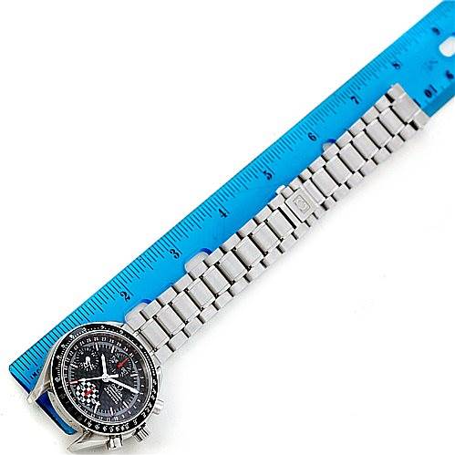 The Omega Speedmaster 3529.50.00 Men
s Stainless Steel Black Dial 3529.50.00 Men
s Stainless Steel Black Dial watch is shown from a top-down angle, displaying its face and metal bracelet alongside a ruler for scale.