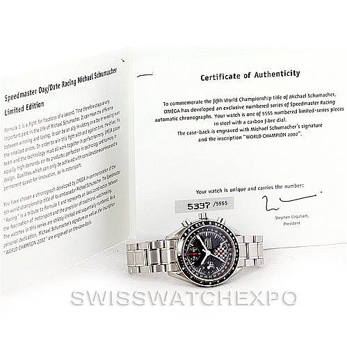 The image shows an Omega Speedmaster 3529.50.00 Men
s Stainless Steel Black Dial 3529.50.00 Men
s Stainless Steel Black Dial watch with its Certificate of Best Quality
ity at an angle showcasing the watch face and metal bracelet.